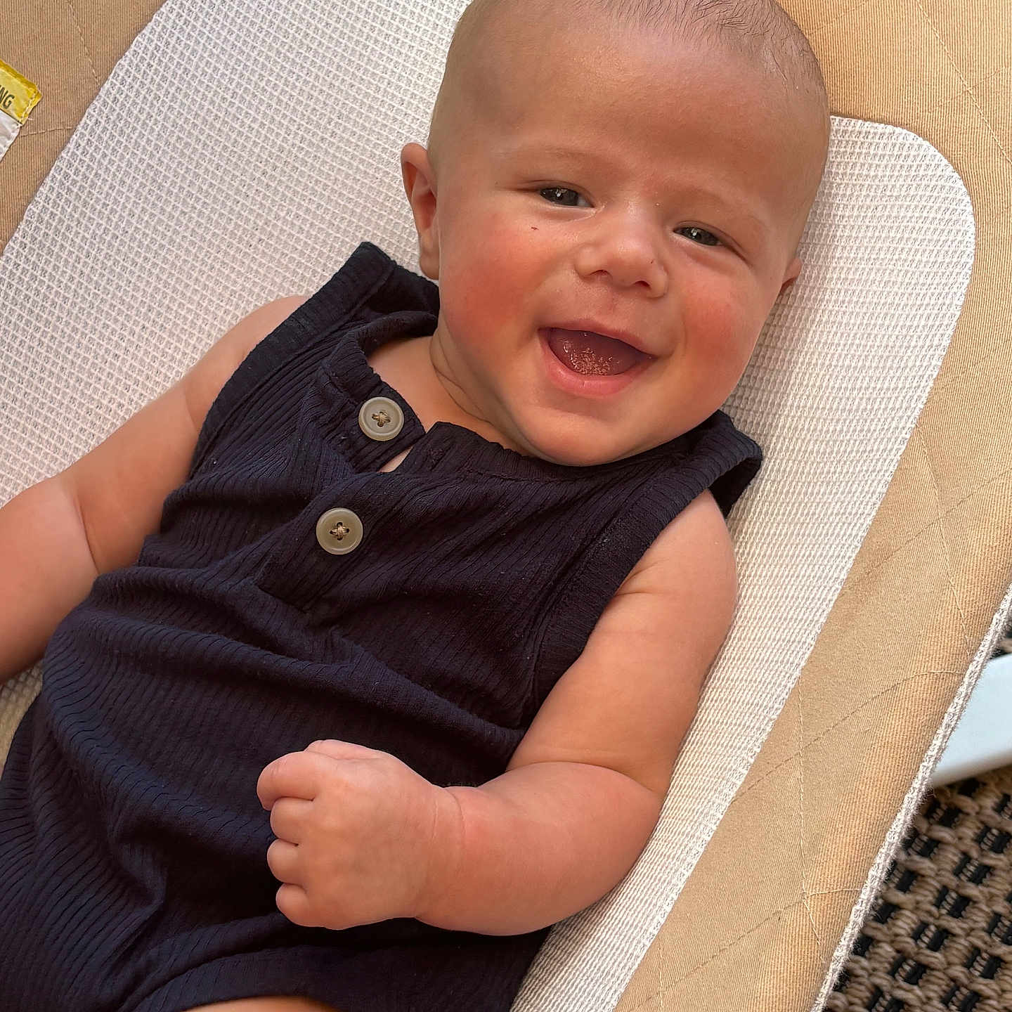Bodhi joined the competition — help win amazing prizes! baby, babylaughing, bodypart, chair, clothing, couch, cushion, dress, face, finger, furniture, hand, happy, head, homedecor, laughing, person, photography, portrait, smile