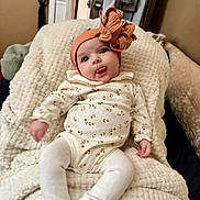 Zaria joined the competition — help win amazing prizes! baby, blanket, child, clothing, cozy, cute, happy, headband, home, indoor, infant, onesie, person, playful, portrait, relaxed, smile, soft_texture, tights, tongue_out