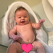 Mccarty joined the competition — help win amazing prizes! baby, bathtub, water, towel, smiling, infant, skin, wet, relaxing, cute, child, bath_time, happy, young, indoors, person, sitting, head, face, newborn