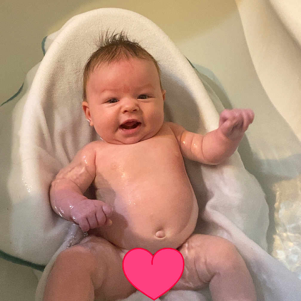Mccarty joined the competition — help win amazing prizes! baby, bath_time, bathtub, child, cute, face, happy, head, indoors, infant, newborn, person, relaxing, sitting, skin, smiling, towel, water, wet, young