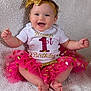 baby, birthday, blanket, bow, celebration, child, clothing, cute, gold, happy, headband, infant, one_year_old, party, pink, portrait, sitting, smile, sparkle, tutu