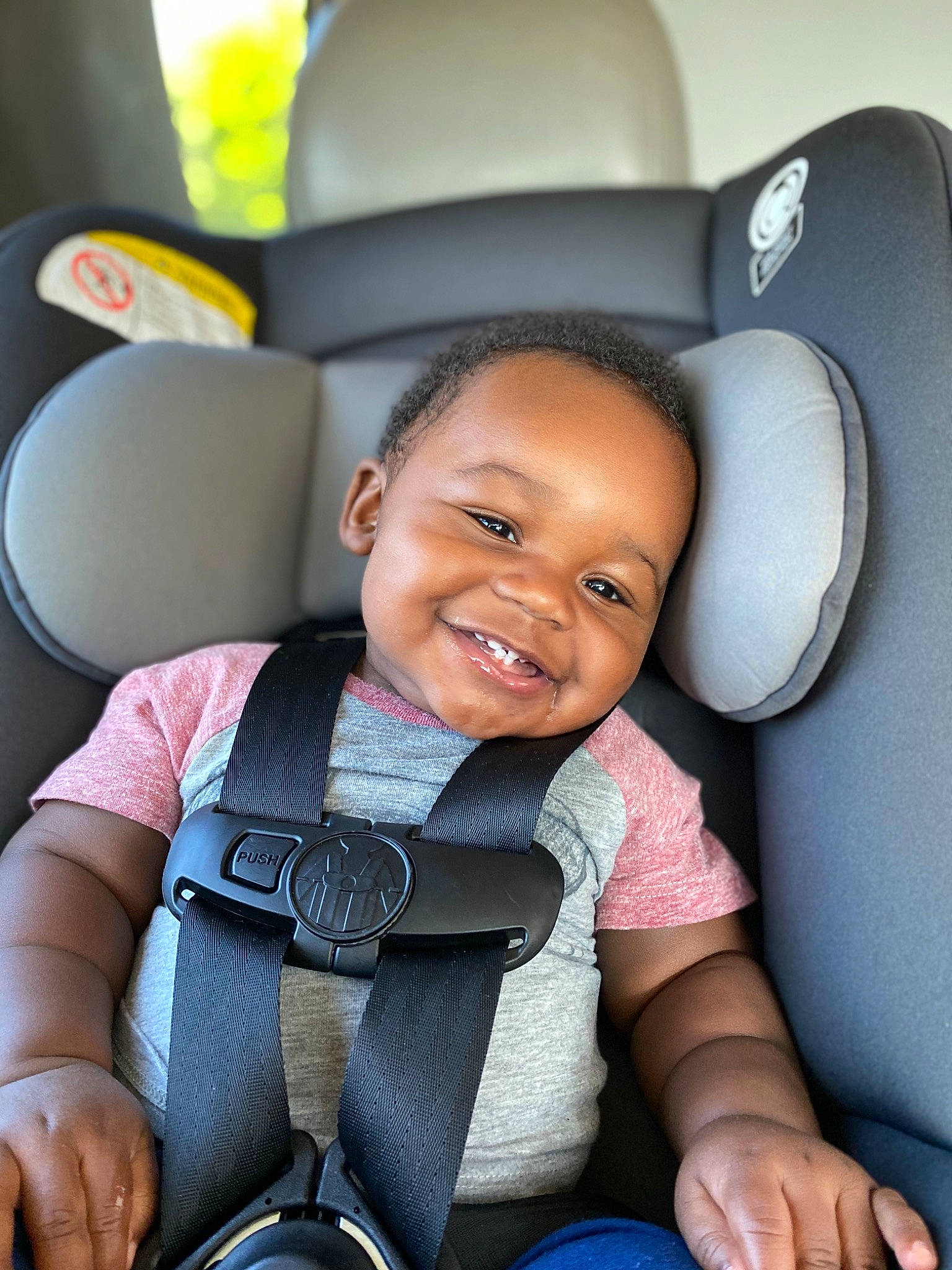 Hakeem joined the competition — help win amazing prizes! auto_part, baby, baby_in_car_seat, car_seat, child, comfort, family_car, fun, head_restraint, joy, person, seat_belt, sitting, smile, toddler, vacation