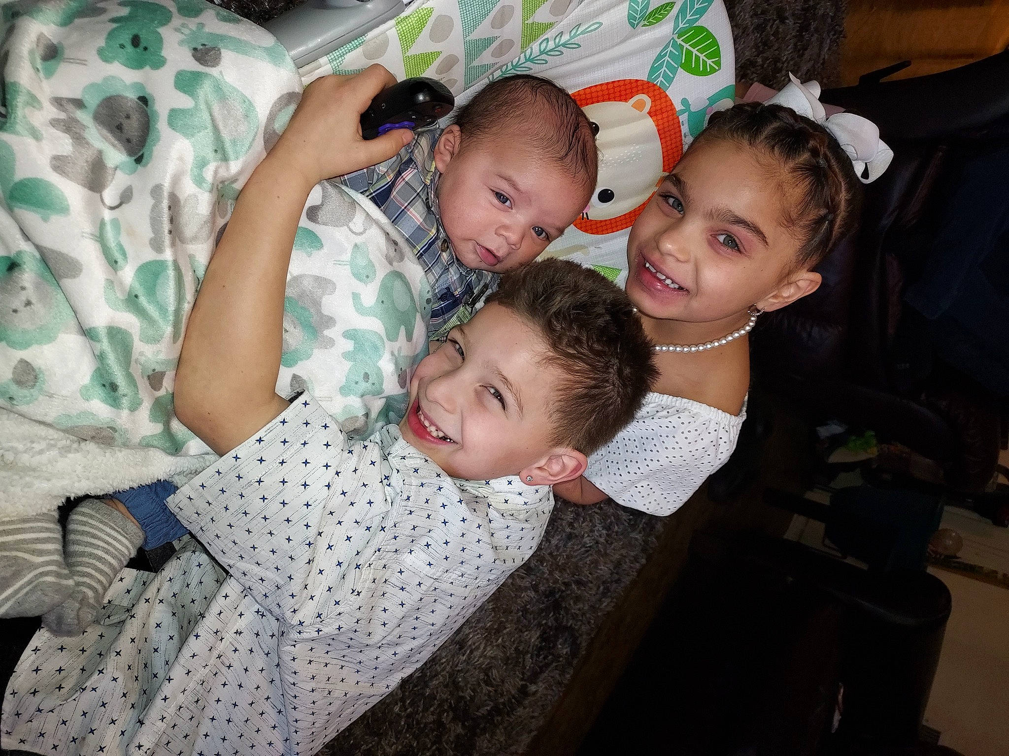 Nevaeh joined the competition — help win amazing prizes! baby, baby_toddler_clothing, child, comfort, couch, event, facial_expression, fun, happy, iris, joy, lap, leisure, pattern, person, room, sharing, sitting, skin, smile