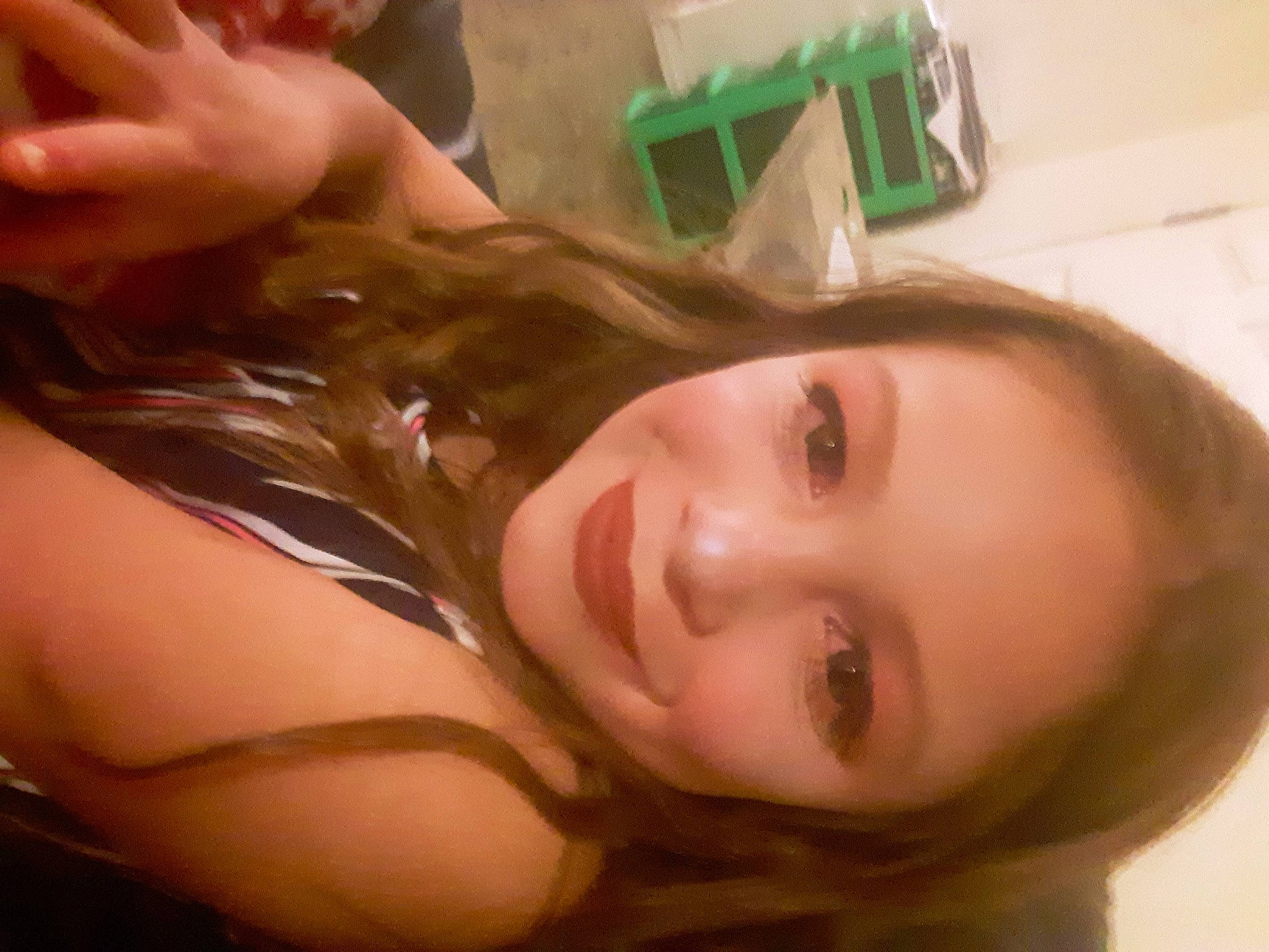 Alanna is registered to the contest to win money with this photo: black_hair, face, joy, mouth, neck, person, selfie, throat