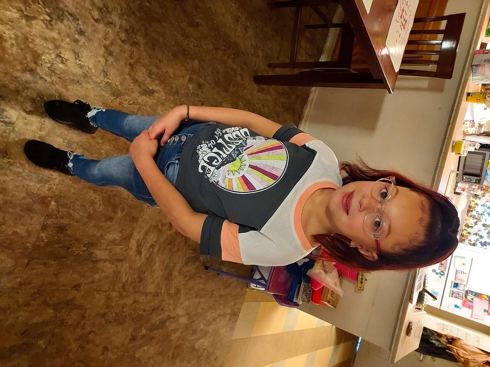 Alanna is registered to the contest to win money with this photo: building, elbow, eyewear, fun, human_leg, landscape, person, room, shelf, shelving, soil, sportswear, t_shirt, thigh, wood, wrist