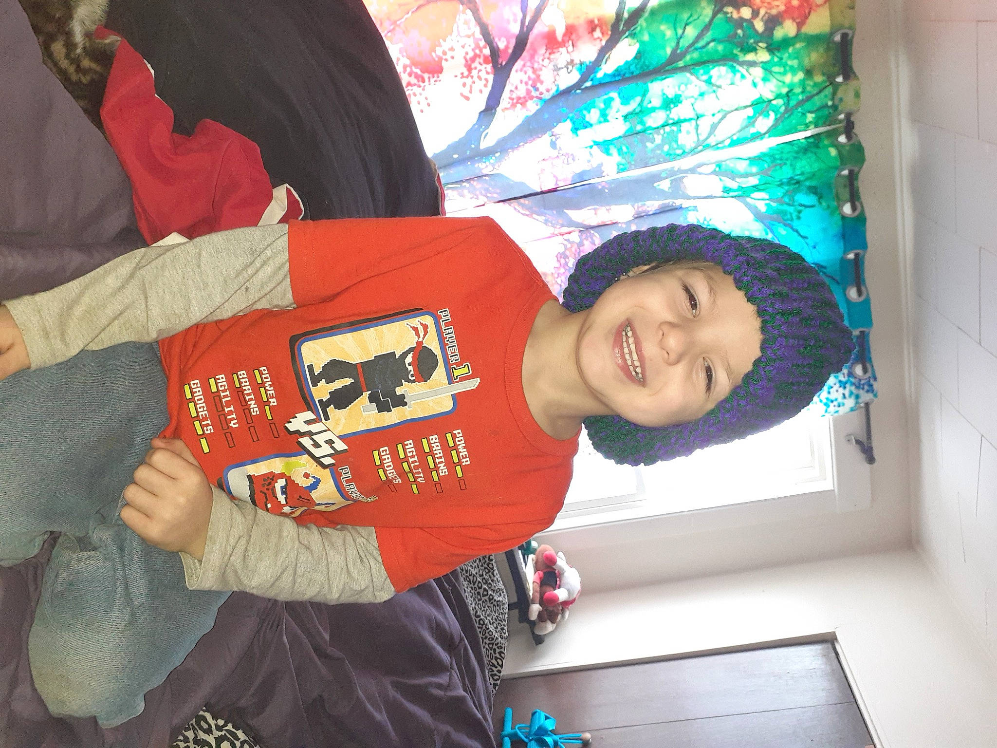 Izayah is registered to the contest to win money with this photo: carmine, child, elbow, electric_blue, event, font, fun, happy, headwear, joy, logo, person, sleeve, smile, sportswear, t_shirt, top, world