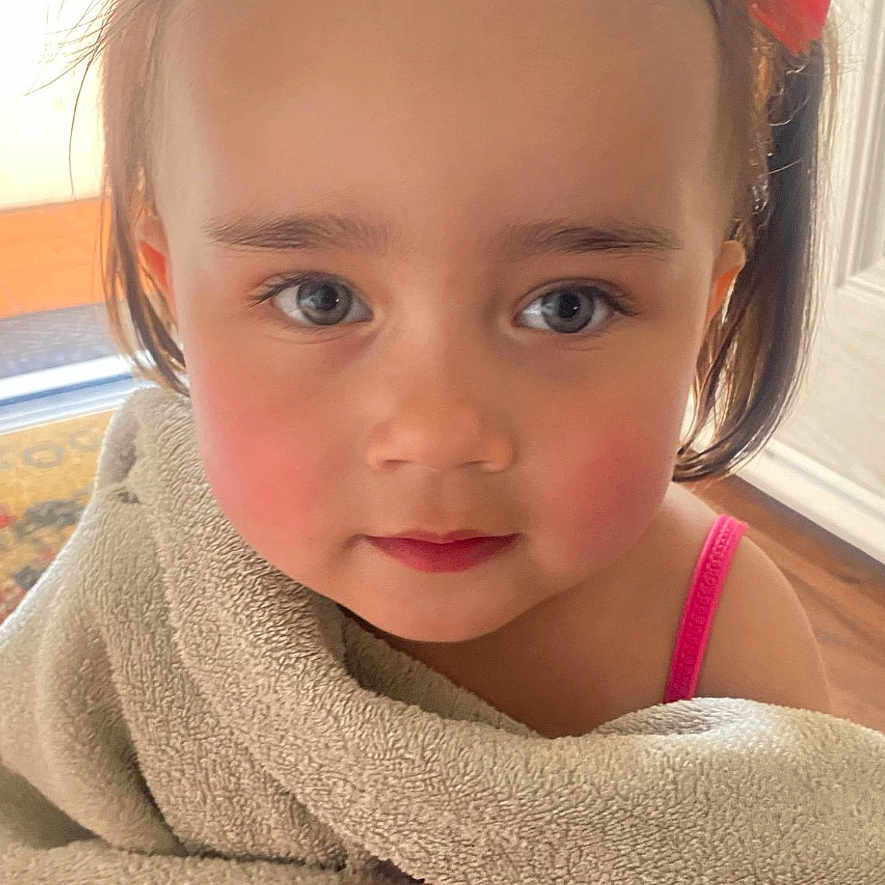 Izabella is registered to the contest to win money with this photo: accessories, baby, blanket, bodypart, clothing, dress, face, finger, hand, happy, head, homedecor, knitwear, linen, person, photography, portrait, smile, sweater, towel