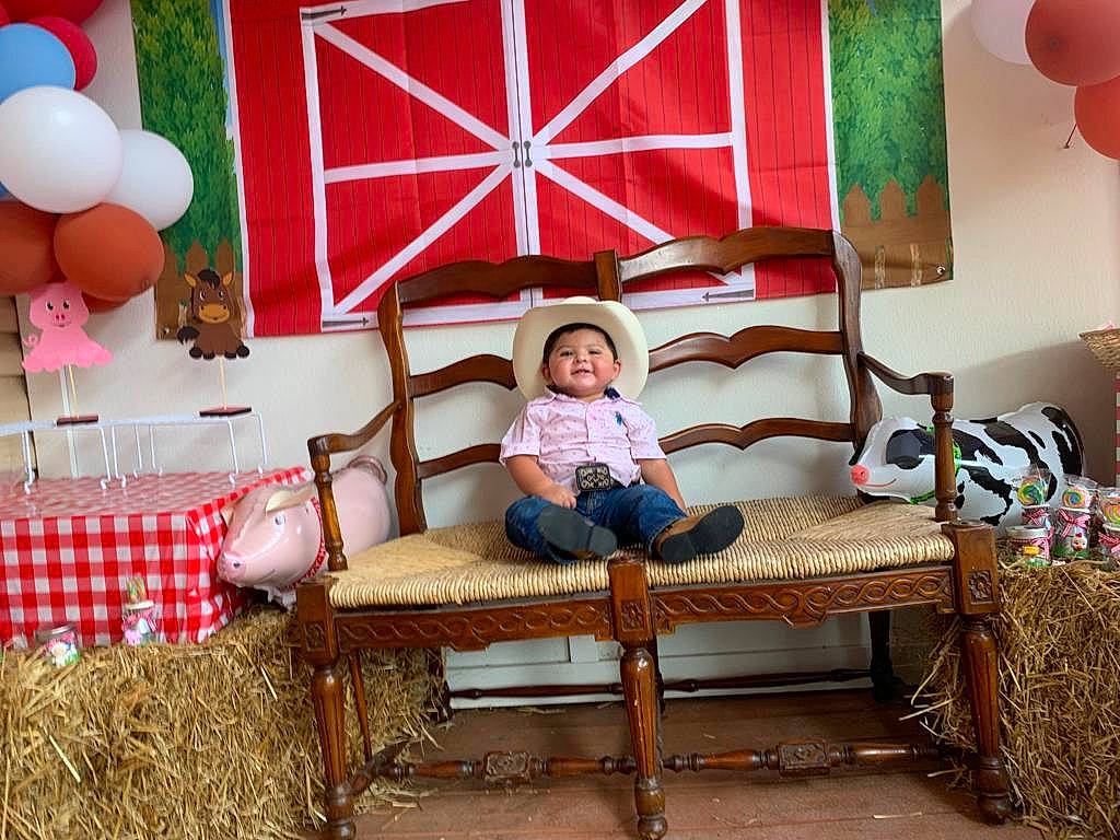 Juanito joined the competition — help win amazing prizes! balloon, coffee_table, comfort, couch, decoration, event, fun, green, house, interior_design, leisure, living_room, magenta, party_supply, person, pillow, property, room, studio_couch, table