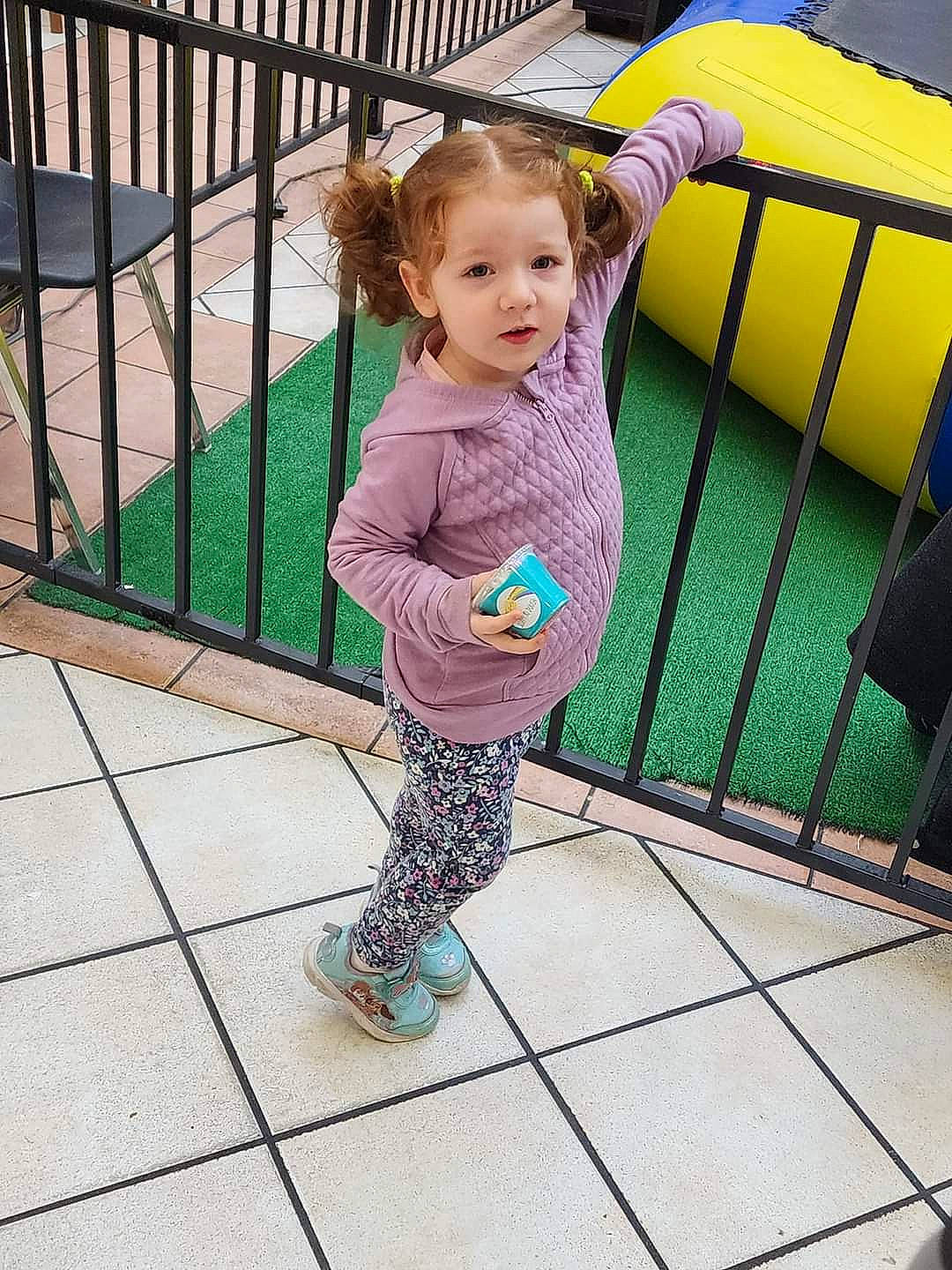 Rosemary is registered to the contest to win money with this photo: baby, baby_products, baby_toddler_clothing, child, city, eye, fence, fun, happy, leisure, magenta, metal, pattern, person, play, recreation, sitting, sleeve, toddler, vacation