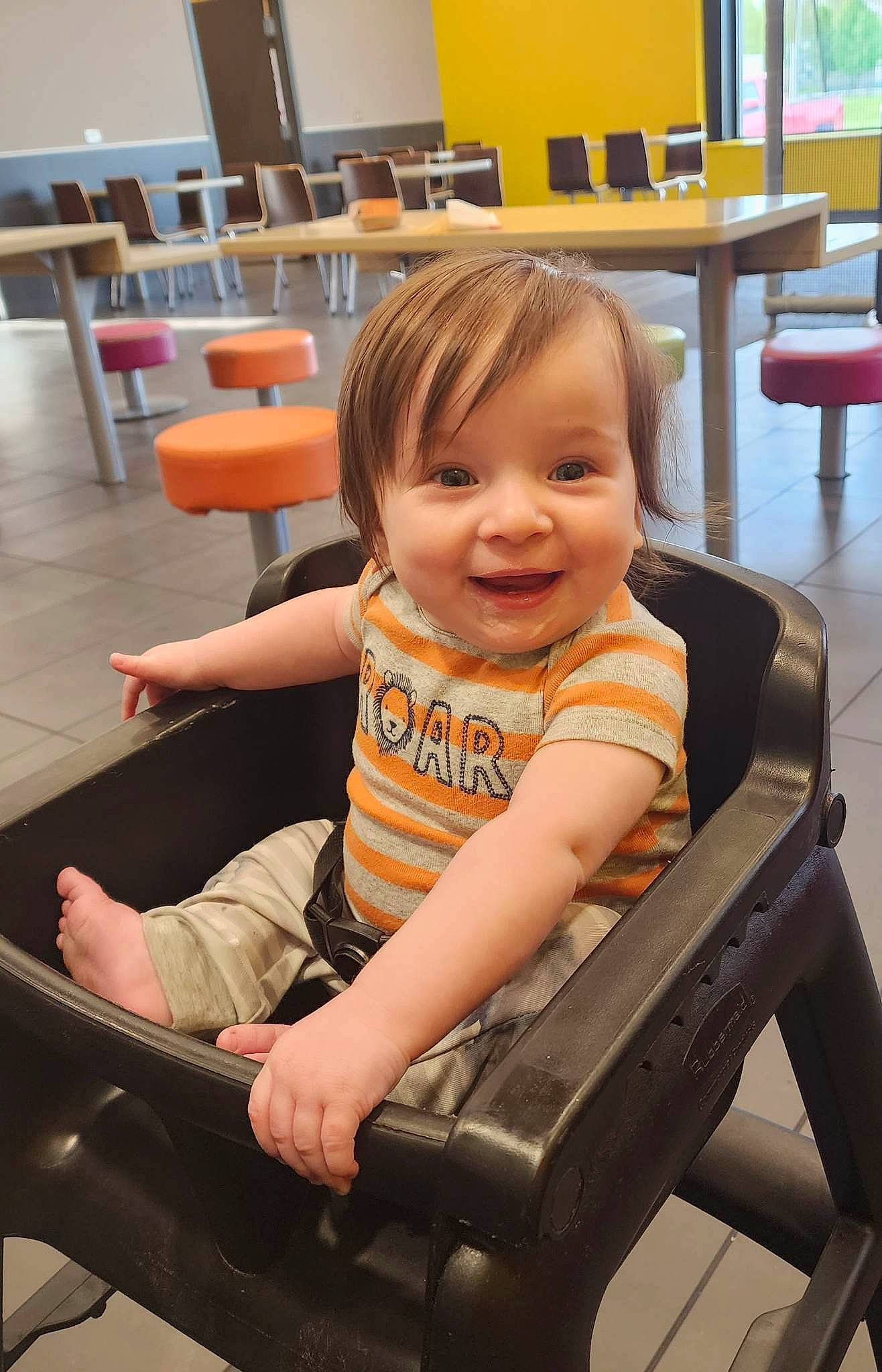 Enoch is registered to the contest to win money with this photo: baby_toddler_clothing, chair, cheek, chin, comfort, finger, fun, furniture, happy, joint, joy, lap, leg, leisure, person, shoulder, sitting, skin, smile, thigh