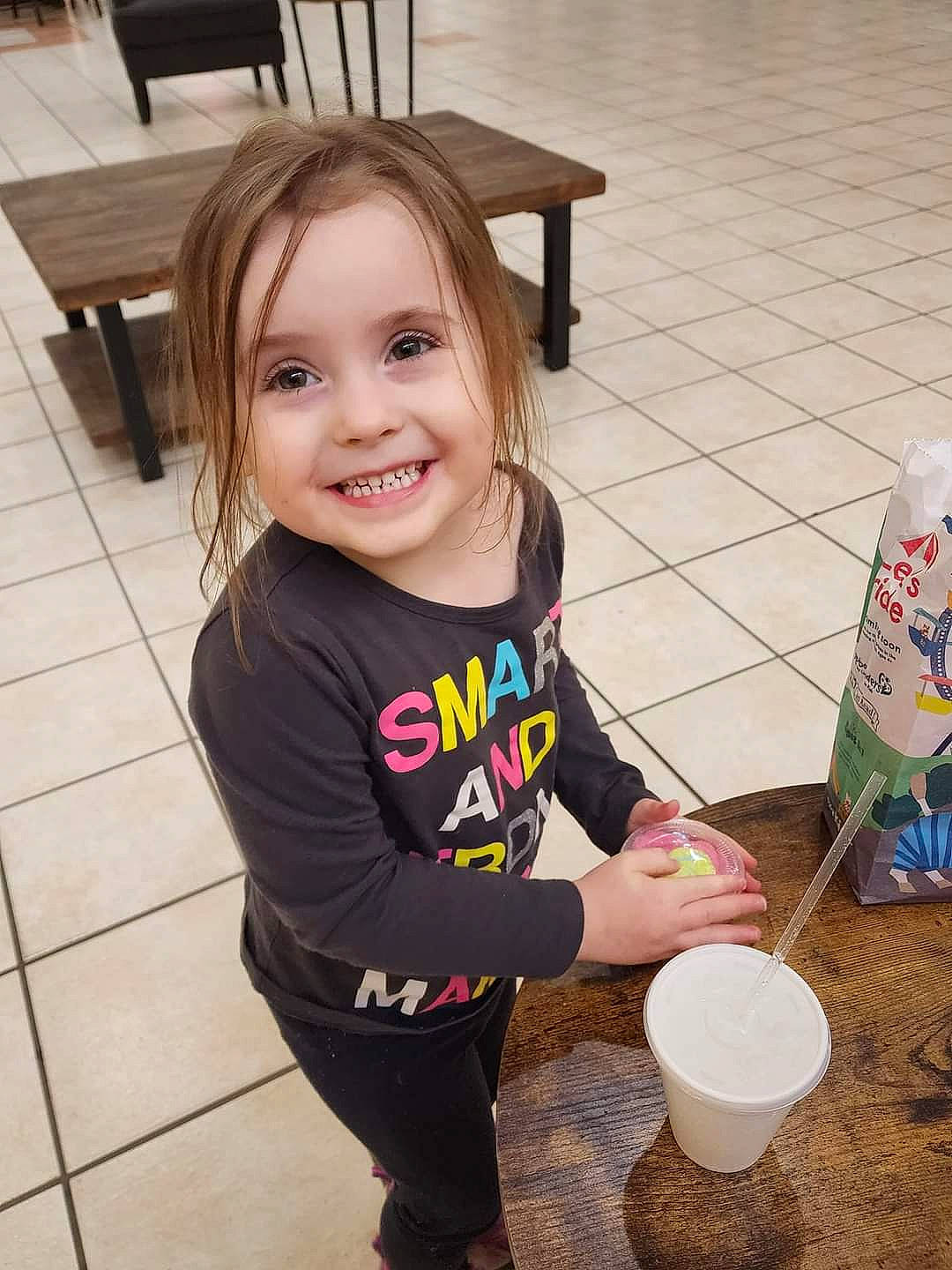 Elliauna is registered to the contest to win money with this photo: baby_toddler_clothing, bottle, child, drink, flooring, fun, happy, hardwood, joy, person, photograph, plastic_bottle, play, sitting, smile, snapshot, t_shirt, tin_can, toddler, water_bottle