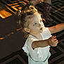 Jersey joined the competition — help win amazing prizes! boots, carpet, casual_wear, child, curly_hair, cute, expression, girl, indoor, kneeling, legs, patterned_rug, playful, portrait, reaching, shadow, sunlight, toddler, white_clothing, young_child