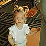 Jersey joined the competition — help win amazing prizes! adult_hand, child, curious_expression, curly_hair, cute, double_buns, floor, holding_hand, indoor, light_and_shadow, natural_light, patterned_rug, person, portrait, shadow, standing, toddler, white_clothing, white_socks, young_child