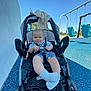 Jameson joined the competition — help win amazing prizes! baby, blue_sky, casual, child, clothing, daytime, happy, infant, outdoor, park, person, playground, seatbelt, smiling, sock, stroller, sunny, swing, toy, wheel