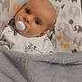 Antonia joined the competition — help win amazing prizes! adorable, baby, baby_bed, blanket, blue_eyes, child, clothing, comfort, cozy, cute, elephant_pattern, face, indoor, infant, pacifier, portrait, resting, sleeping_bed, soft_texture, young