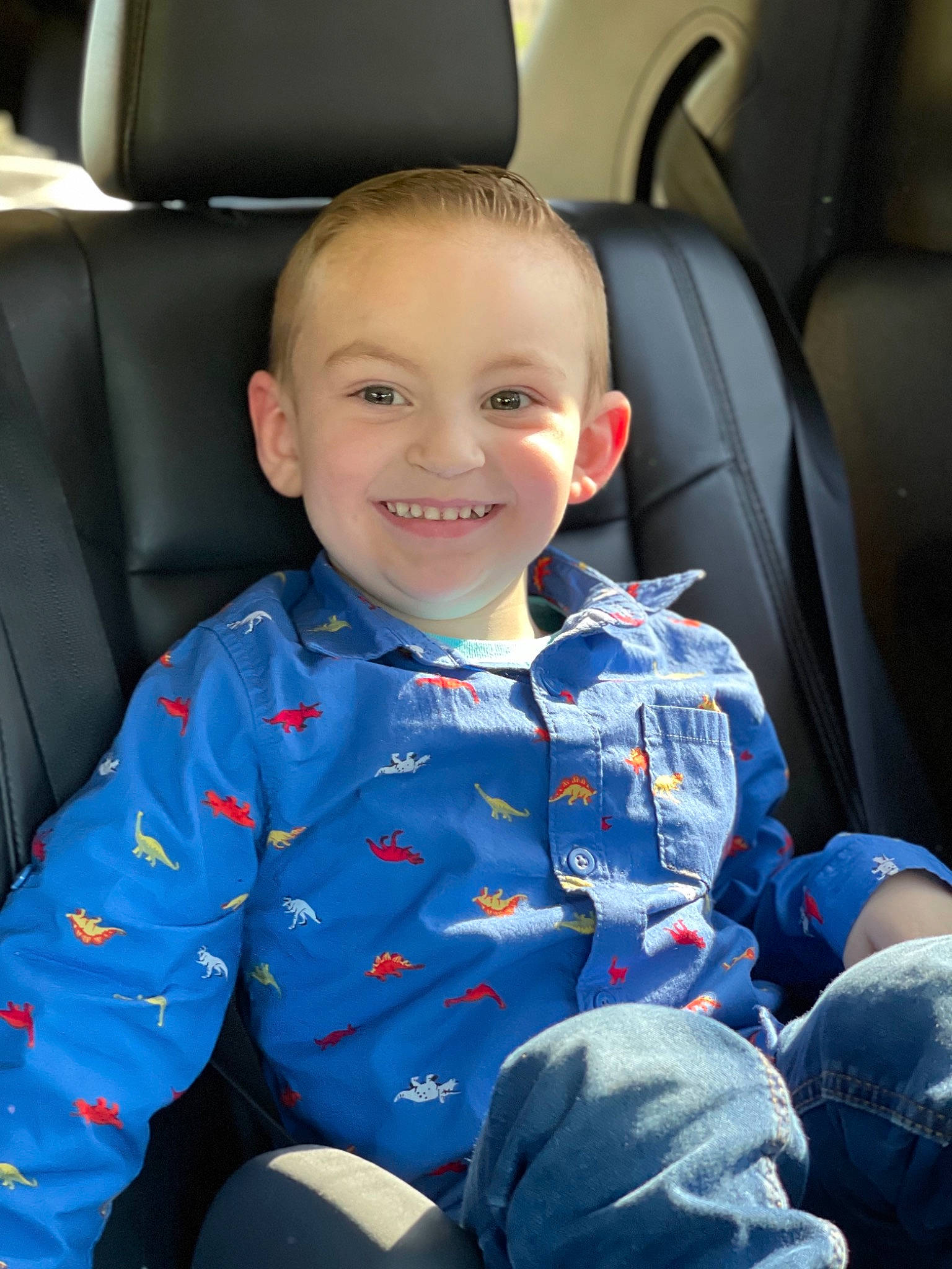 Ryder is registered to the contest to win money with this photo: auto_part, automotive_design, baby_toddler_clothing, car_seat, car_seat_cover, comfort, face, facial_expression, finger, head_restraint, human, joy, motor_vehicle, person, product, seat_belt, skin, sleeve, smile, toddler