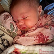 Wyndsor joined the competition — help win amazing prizes! baby, sleeping, blanket, floral, cozy, infant, child, swaddled, soft_lighting, peaceful, cute, portrait, face, closeup, comfort, pink, clothing, resting, indoor, toddler