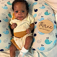 Nash joined the competition — help win amazing prizes! baby, infant, child, cute, whale_pattern, cushion, knitwear, white_socks, curly_hair, bright_eyes, soft_blanket, indoor, portrait, three_months, smiling, cozy, lying_down, small_hands, baby_clothes, comfortable