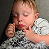 Micah joined the competition — help win amazing prizes! baby, sleeping, blanket, couch, cozy, face, child, infant, peaceful, rest, soft, indoors, cute, portrait, head, hands, relaxing, comfort, nap, young