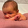 baby, newborn, infant, face, skin, arm, blanket, pink, lying_down, expression, curious, indoors, head, hair, person, child, closeup, soft, resting, portrait