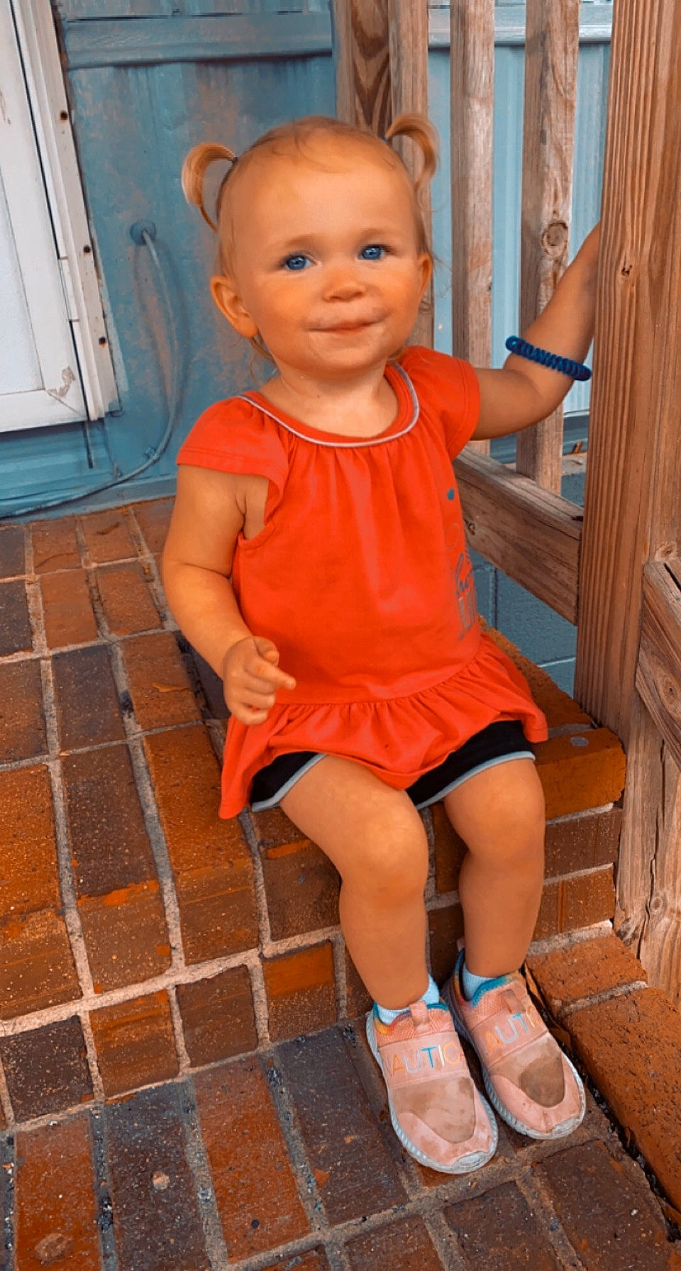 Gracelyn is registered to the contest to win money with this photo: baby, baby_toddler_clothing, blue, cheek, child, chin, eye, face, flooring, human_leg, joint, joy, knee, leg, organ, person, pink, skin, smile, standing