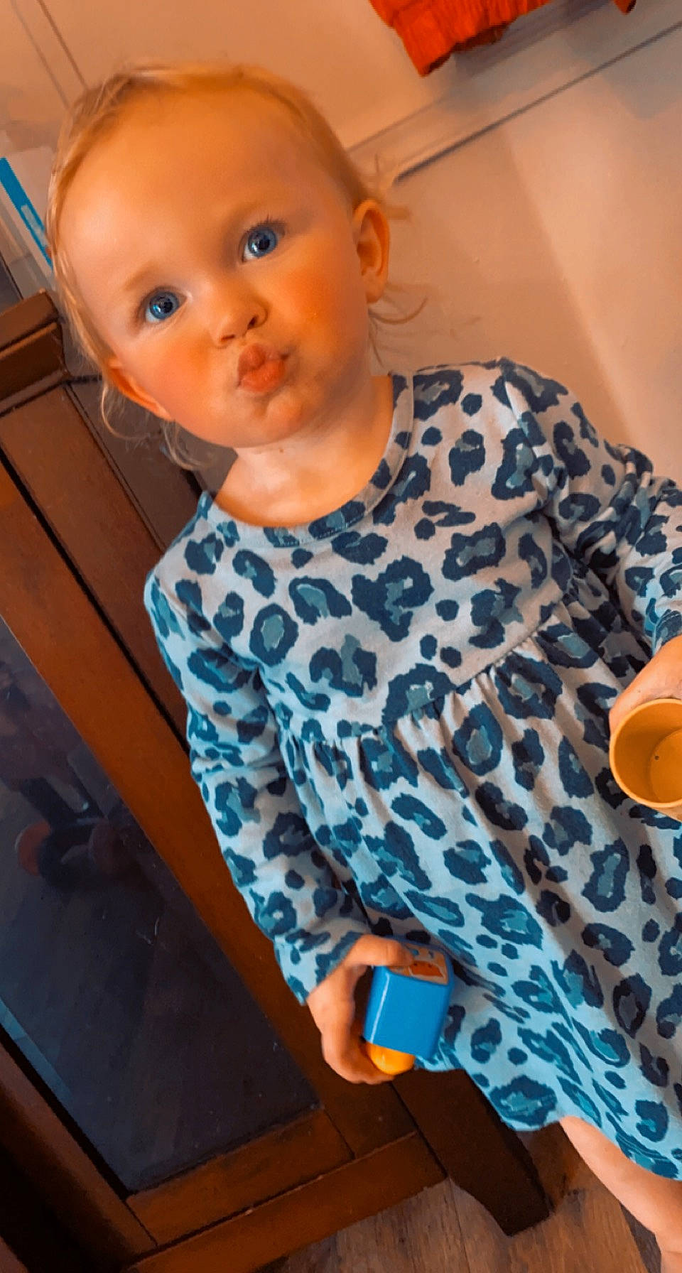 Gracelyn joined the competition — help win amazing prizes! baby_toddler_clothing, blue, cheek, eye, face, finger, floor, hairstyle, head, human_body, joint, leg, neck, nose, orange, person, shoulder, skin, sleeve, standing