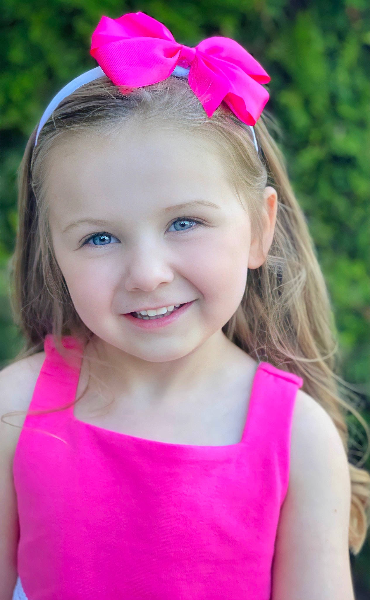 Rayley joined the competition — help win amazing prizes! baby_toddler_clothing, blond, chin, clothing, eye, fun, grass, happy, head, headband, headpiece, iris, joy, magenta, person, petal, pink, plant, purple, smile