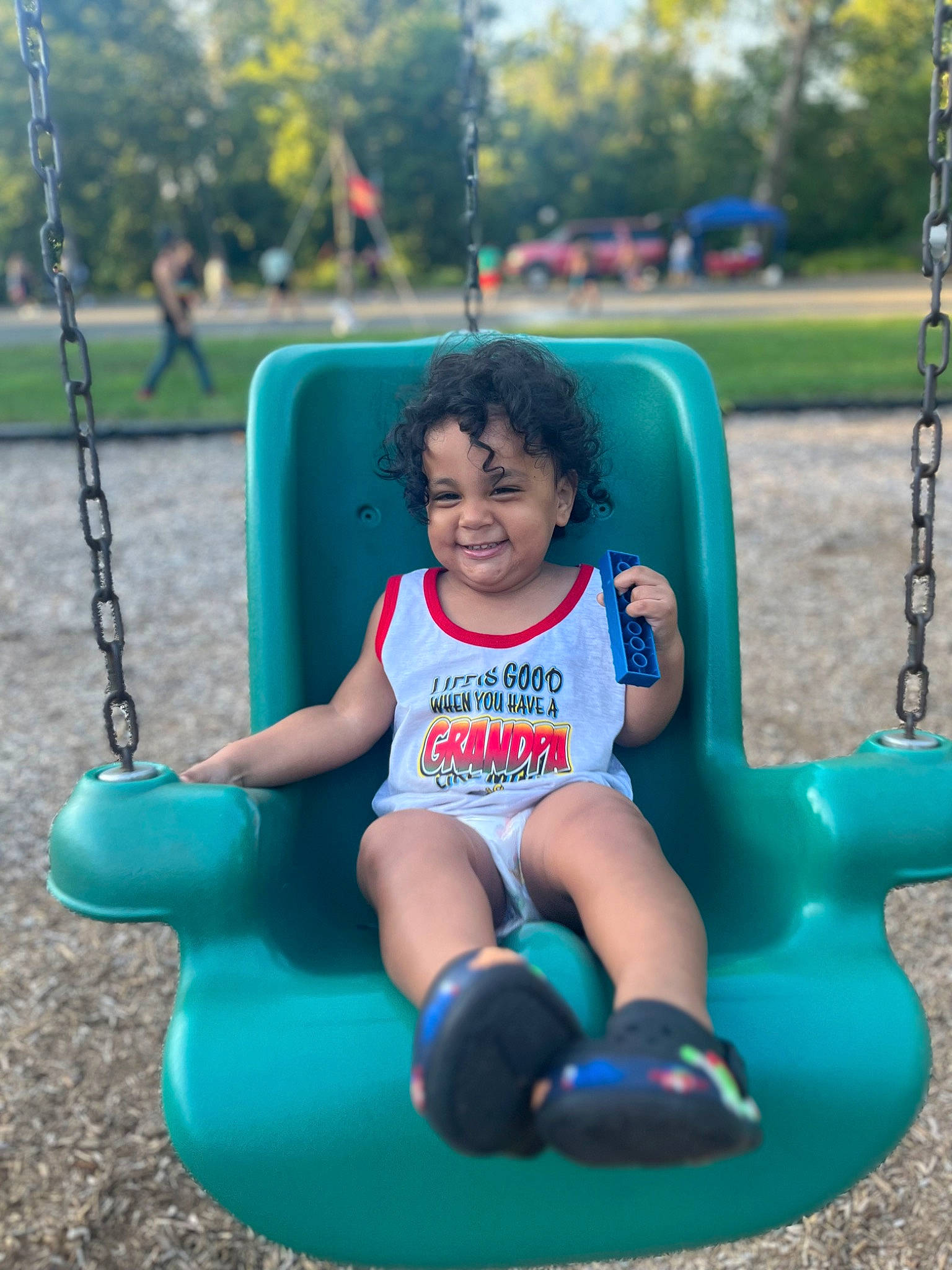 Akeoni joined the competition — help win amazing prizes! arm, black, blue, electric_blue, face, fun, green, hair, happy, head, joy, leisure, person, photograph, playground, recreation, shorts, smile, toddler, tree