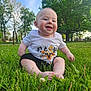 baby, child, cute, daytime, grass, greenery, happy, infant, nature, outdoor, park, playful, portrait, shorts, sitting, sky, smiling, sunlight, tree, tshirt