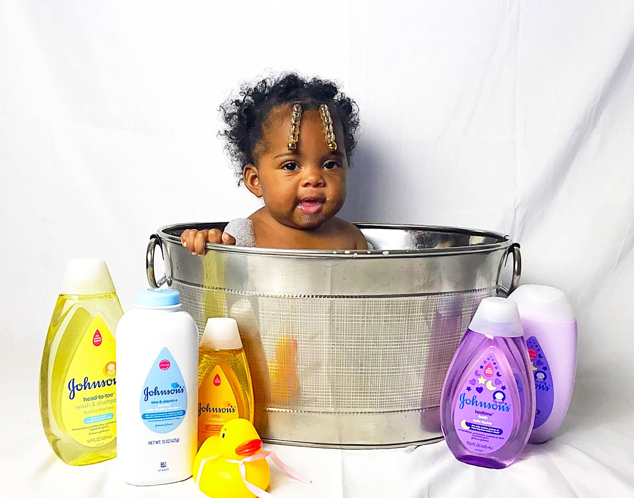 Ana Lynn joined the competition — help win amazing prizes! baby, baby_products, basket, bottle_cap, bowl, child, drinkware, eyelash, fashion_accessory, fluid, happy, household_supply, liquid, material_property, person, personal_care, plastic, plastic_bottle, room, service