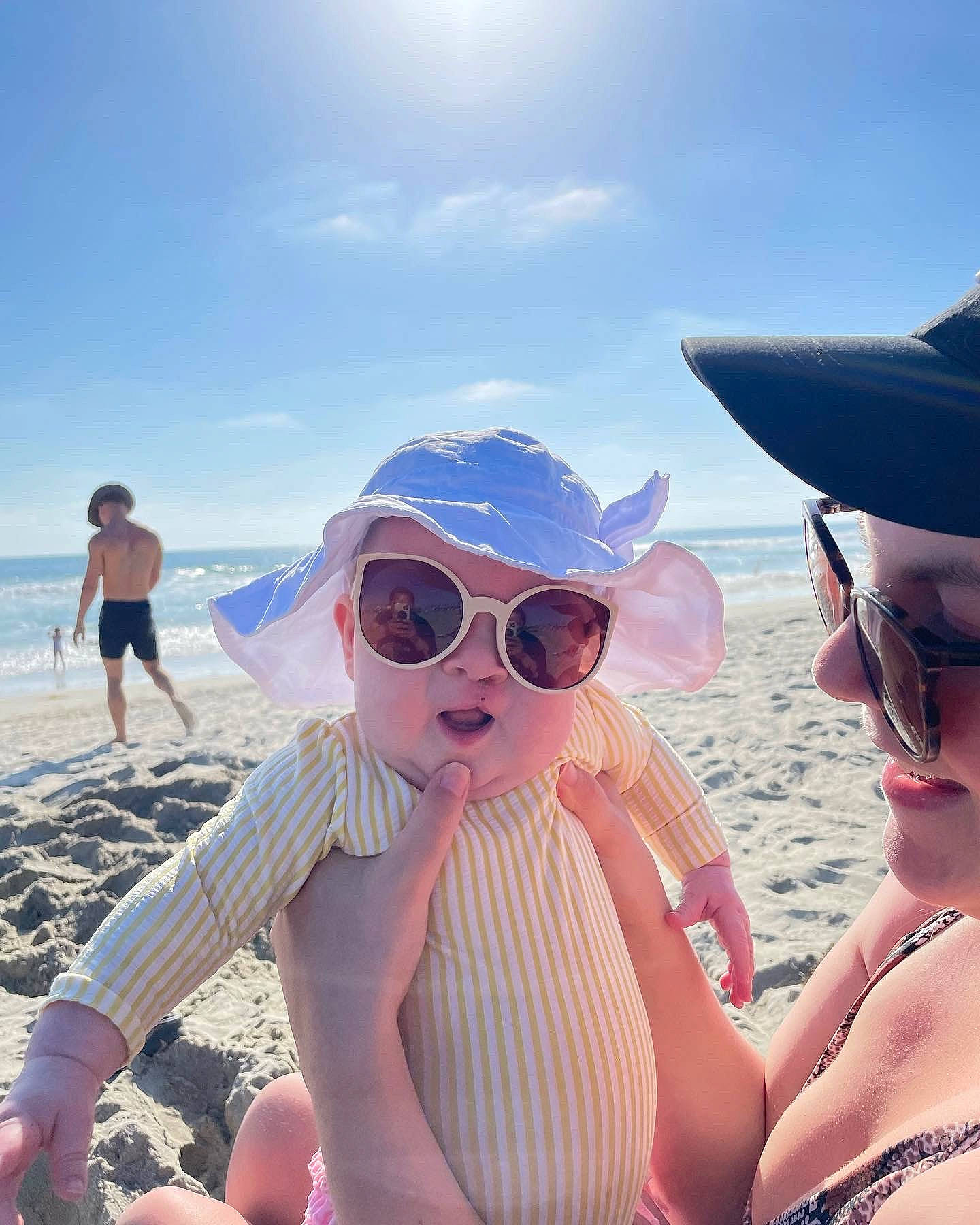 Lennon joined the competition — help win amazing prizes! beach, body_of_water, cloud, cool, eyewear, fun, glasses, goggles, happy, hat, headwear, leisure, light, people_in_nature, people_on_beach, person, sky, sun_hat, sunglasses, sunlight