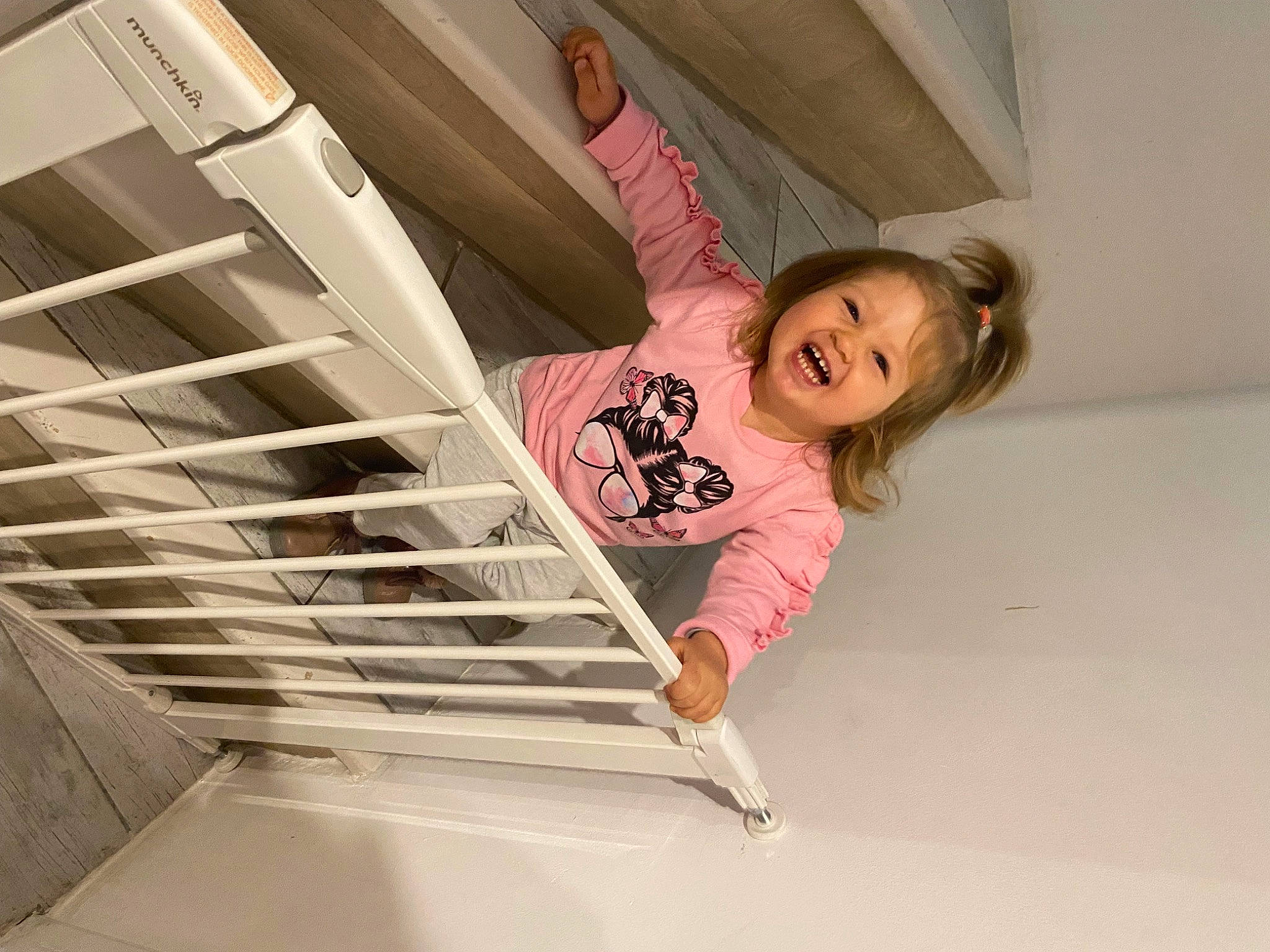 Louise participe au concours pour gagner de l'argent avec cette photo : baby_toddler_clothing, ceiling, child, comfort, elbow, floor, flooring, fun, happy, hardwood, human_leg, magenta, person, room, smile, stairs, t_shirt, thigh, toddler, window