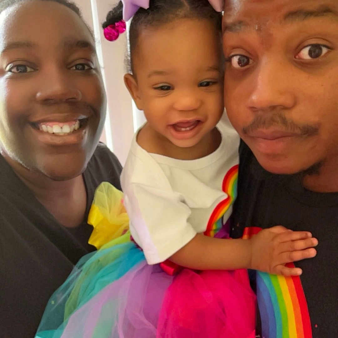Elyzah is registered to the contest to win money with this photo: family, child, toddler, adult, smiling, rainbow, tutu, bows, portrait, indoor, happy, people, clothing, colorful, closeup, person, fashion, cute, holding, background