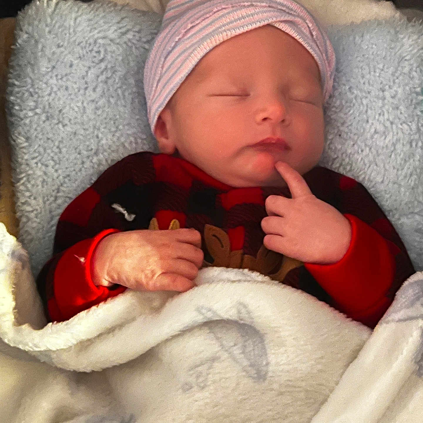 Stetson joined the competition — help win amazing prizes! baby, blanket, child, cozy, cute, face, hand, hat, indoors, infant, newborn, peaceful, pillow, plaid, portrait, red_clothing, resting, sleeping, soft_texture, striped_hat