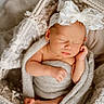 newborn, baby, sleeping, blanket, basket, headband, lace, bow, cozy, soft, wrapped, infant, peaceful, cute, tiny, feet, hand, portrait, indoors, resting