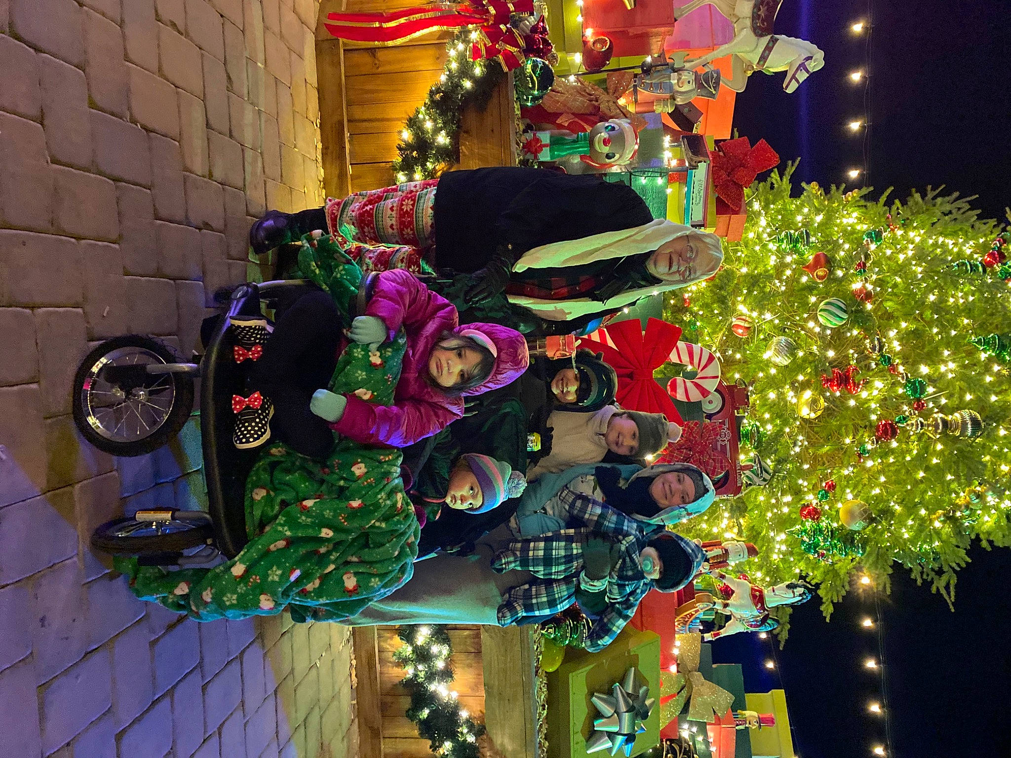 Nevaeh joined the competition — help win amazing prizes! christmas, christmas_decoration, christmas_eve, christmas_lights, christmas_ornament, christmas_tree, conifer, decoration, event, festival, fir, green, headwear, holiday, holiday_ornament, interior_design, joy, magenta, ornament, person