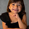 child, smile, portrait, face, black_clothing, young, cute, happy, person, studio, posing, short_hair, innocence, hands, expression, closeup, background, childhood, casual, friendly