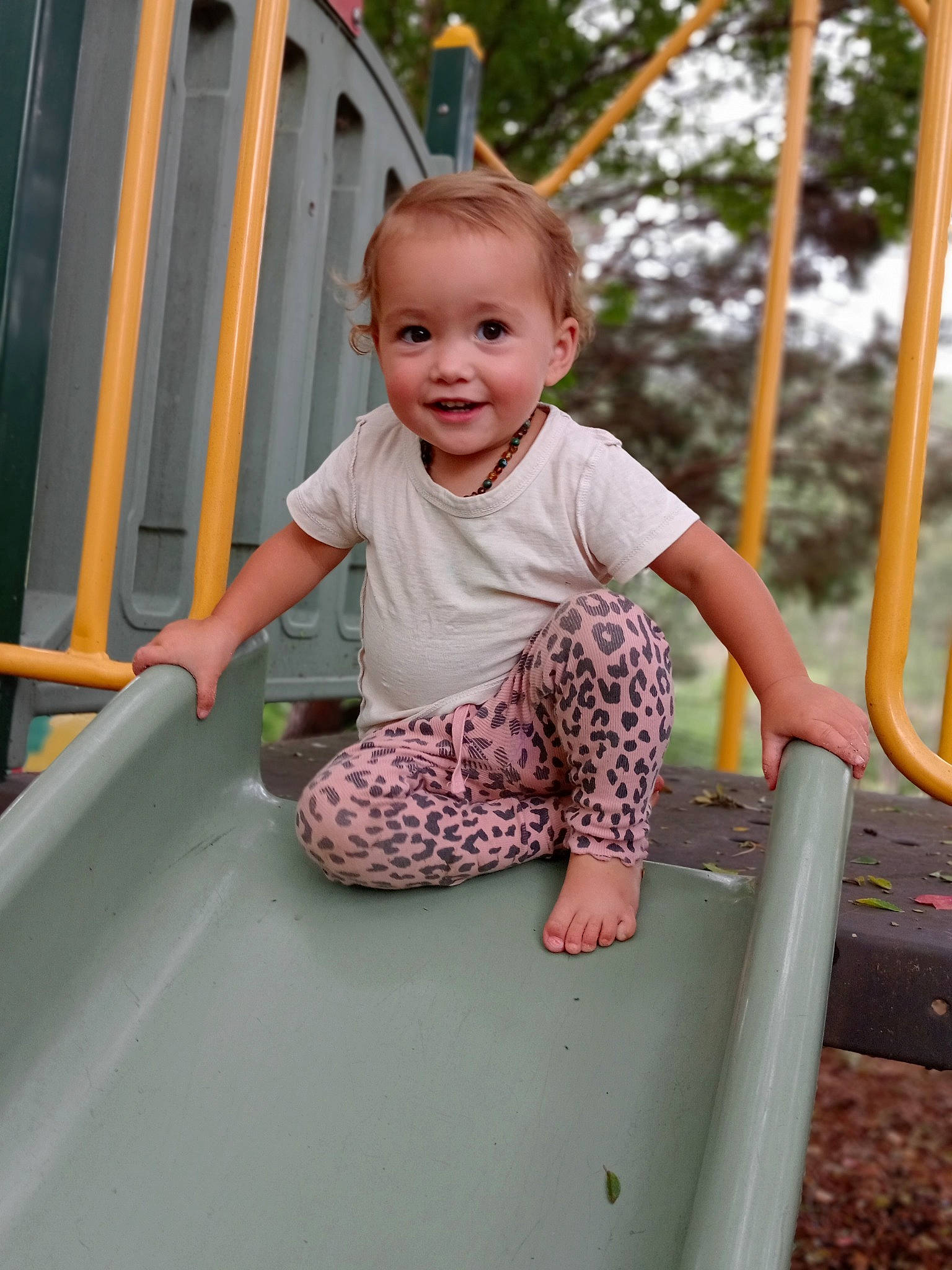 Lilly-ray joined the competition — help win amazing prizes! baby, baby_toddler_clothing, child, city, facial_expression, fun, grass, happy, joy, leisure, outdoor_play_equipment, person, pink, playground, recreation, shorts, skin, sleeve, smile, standing