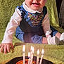 Abigaël participe au concours pour gagner de l'argent avec cette photo : baby, child, birthday, candles, cake, tart, smiling, headband, dress, sitting, green_blanket, happy, indoors, celebration, cute, portrait, food, lighting, hands, footwear