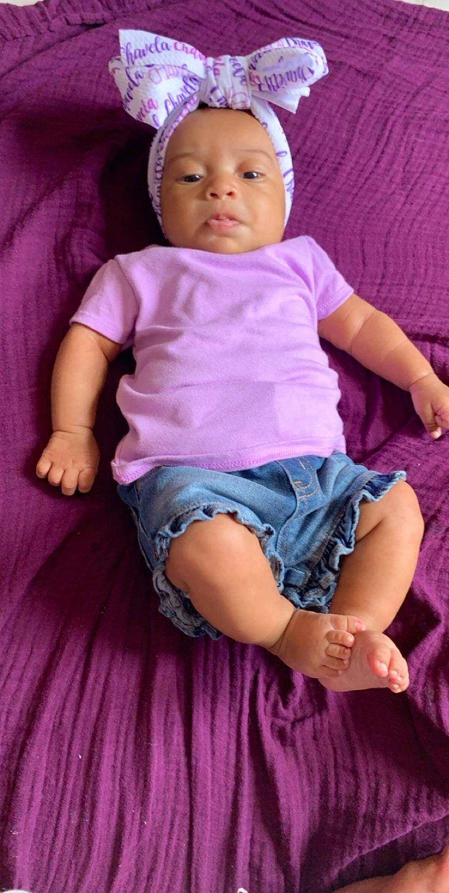 Jurnee joined the competition — help win amazing prizes! baby, baby_products, baby_toddler_clothing, cheek, child, headgear, lavender, lilac, magenta, person, pink, purple, sitting, skin, toddler, violet