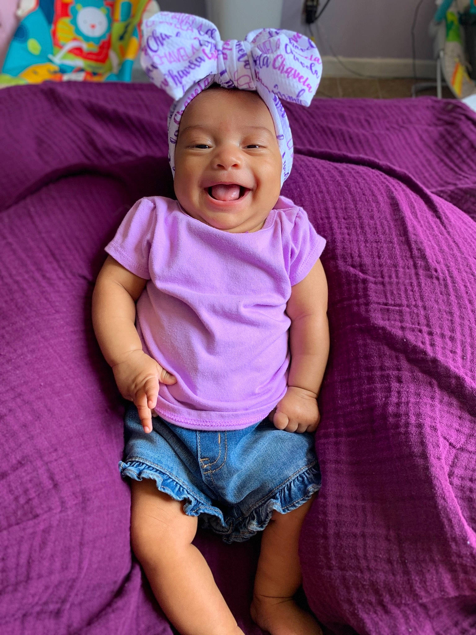 Jurnee is registered to the contest to win money with this photo: baby, cheek, child, ear, eye, face, fun, happy, head, headgear, magenta, organ, person, photography, pink, purple, skin, smile, textile, toddler