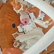 Ulysse a rejoint le concours — aidez-le/la à gagner de superbes lots ! baby, newborn, yawning, blanket, plush_toy, lion, baby_gym, soft_toy, sleepwear, hat, infant, cozy, play_mat, cute, child, indoors, resting, wrapped, peaceful, nursery