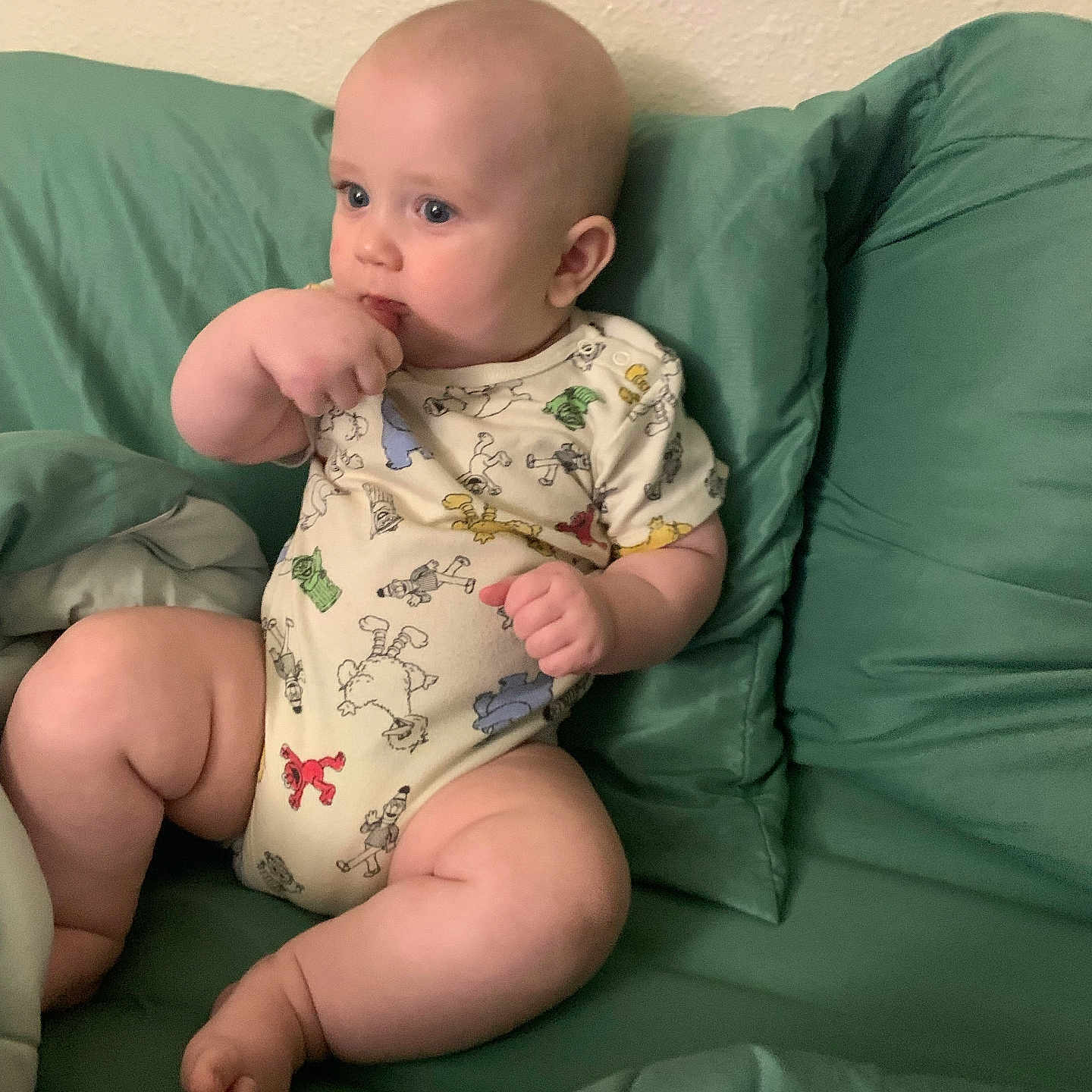 Maddox joined the competition — help win amazing prizes! baby, blue_eyes, casual, child, chubby, comfort, couch, cute, face, hand, indoors, infant, onesie, pillow, plush, relaxed, sitting, skin, thoughtful, young_child