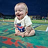 Lukas joined the competition — help win amazing prizes! baby, child, baseball_field, night, smiling, happy, sports, net, outdoor, colorful, infant, sitting, clothing, grass, game, stadium, people, cute, portrait, fun