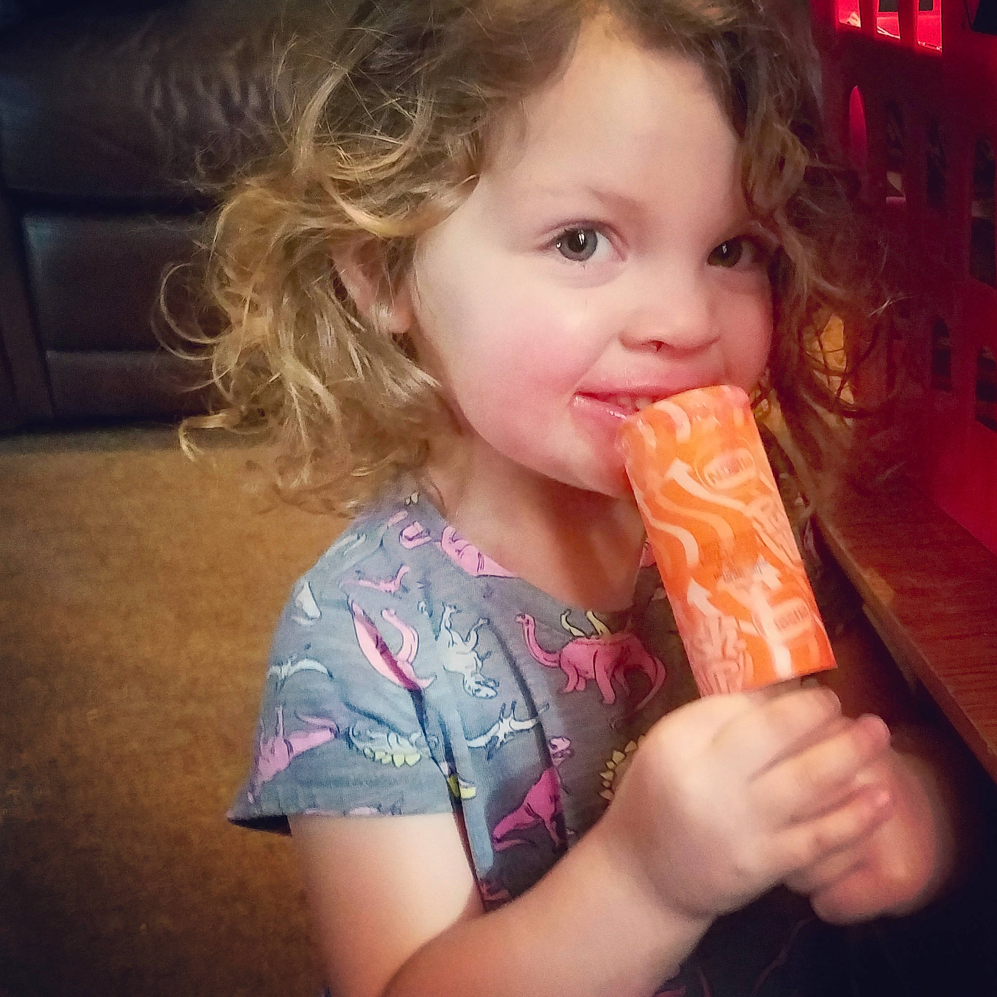 Gia is registered to the contest to win money with this photo: brown_hair, child, eating, finger, food, long_hair, nose, person, sweetness, toddler