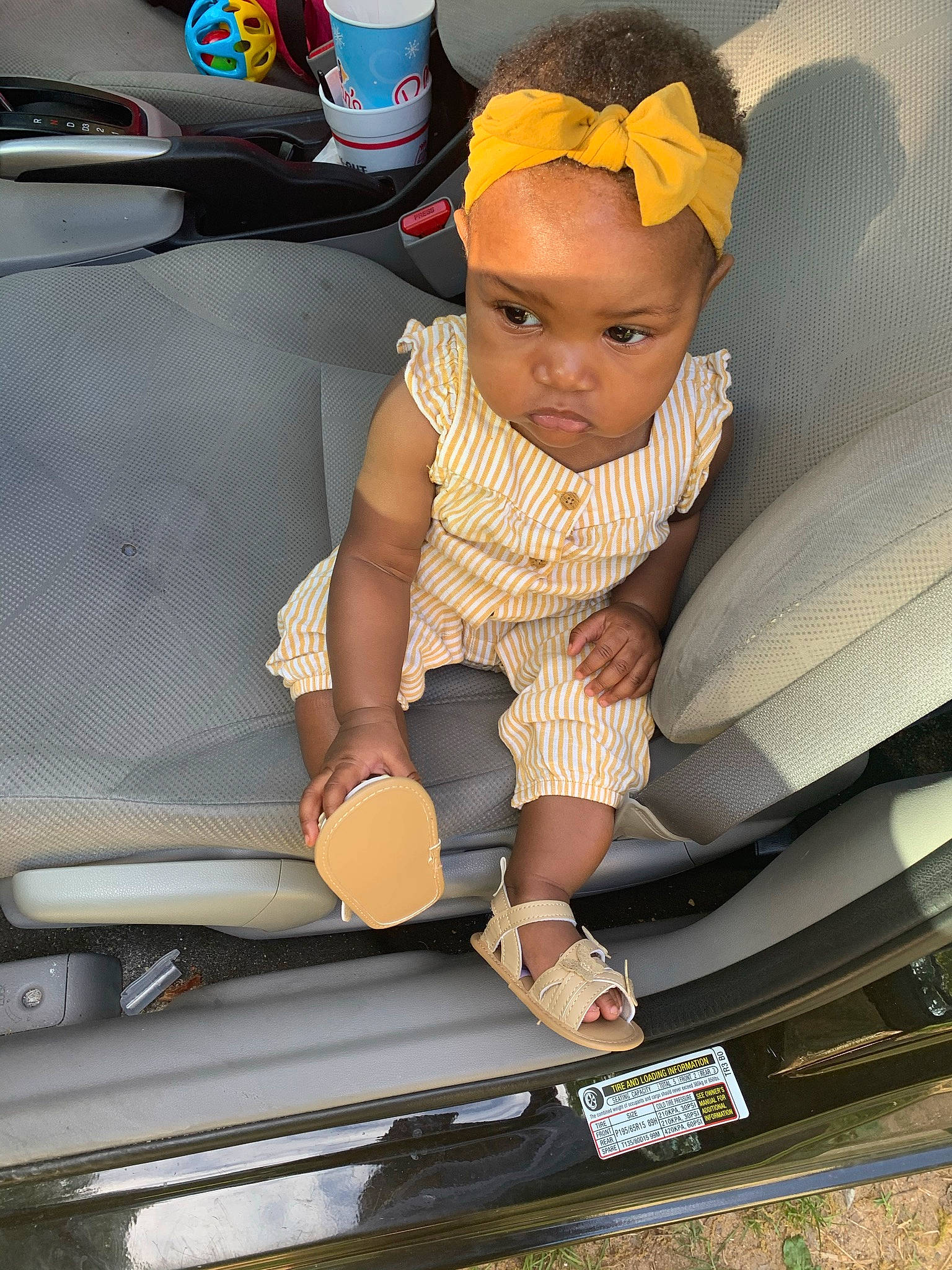 Jaloni is registered to the contest to win money with this photo: auto_part, automotive_design, automotive_exterior, automotive_lighting, automotive_tire, automotive_wheel_system, baby, baby_toddler_clothing, bumper, car_seat, child, comfort, family_car, hat, motor_vehicle, person, sitting, sneakers, toddler, trunk