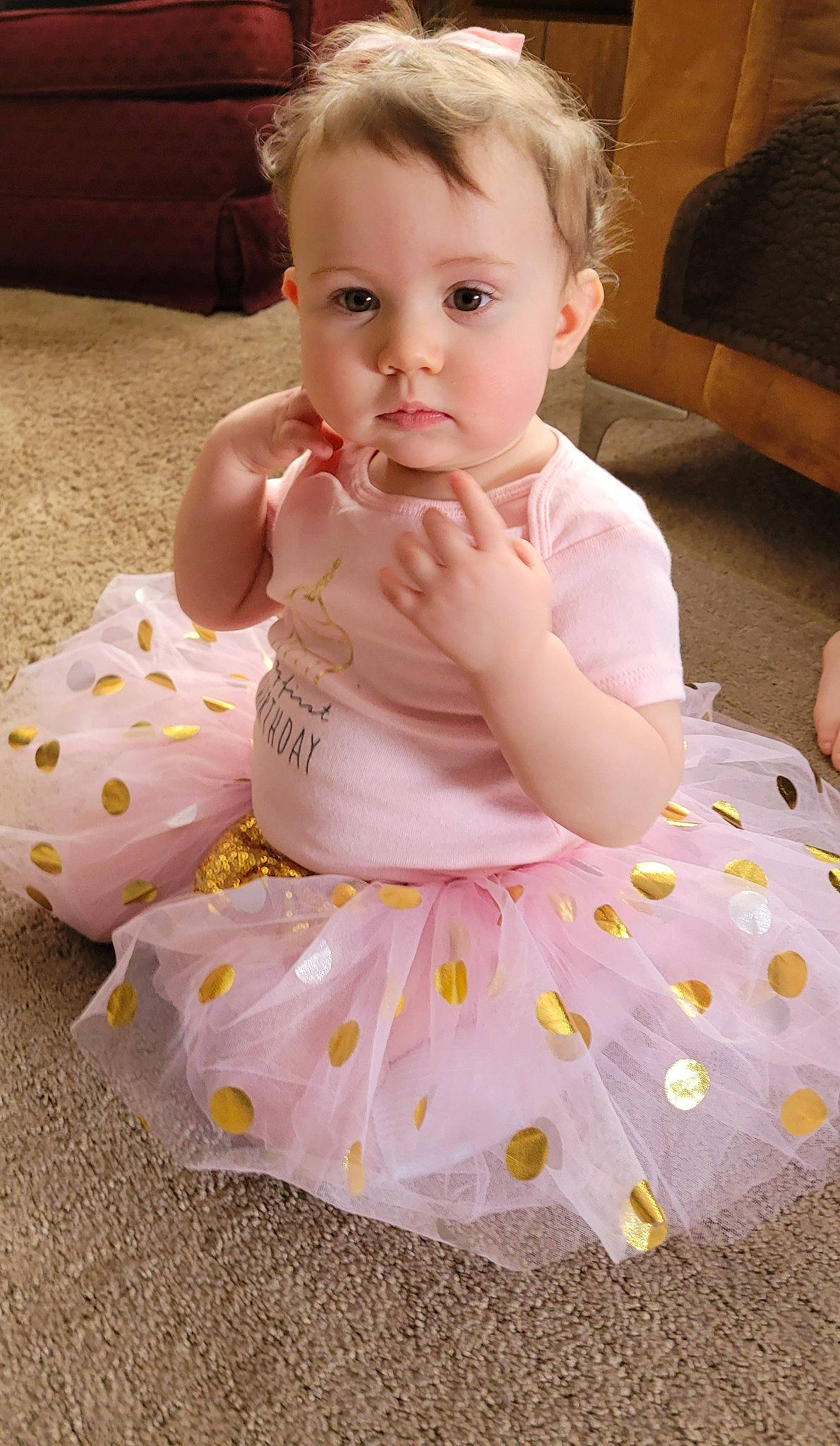 Lily joined the competition — help win amazing prizes! baby, baby_toddler_clothing, cheek, child, comfort, dress, eye, face, facial_expression, finger, fun, happy, head, iris, pattern, person, pink, product, skin, sleeve