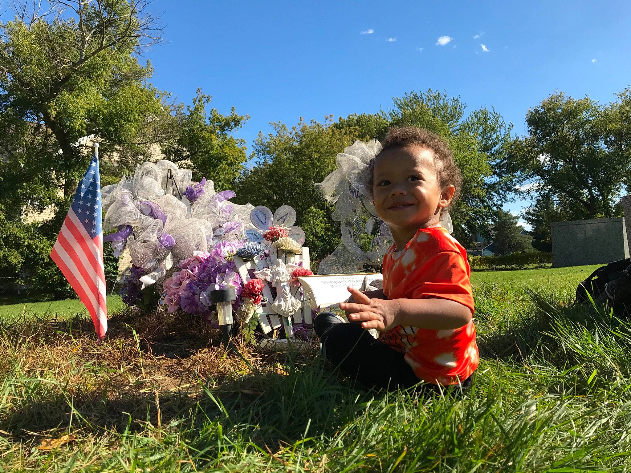 Braxton is registered to the contest to win money with this photo: child, flag, flag_of_the_united_states, garden, holiday, human, joy, meadow, memorial_day, people_in_nature, person, pinwheel, play, pole, spring, t_shirt, toddler, toy, yard