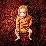 Eden joined the competition — help win amazing prizes! baby, infant, child, hooded_outfit, orange_clothing, fluffy_rug, texture, sitting, looking_up, curious_expression, hands, bare_feet, indoor, portrait, cute, young, soft_lighting, cozy, warm_colors, casual