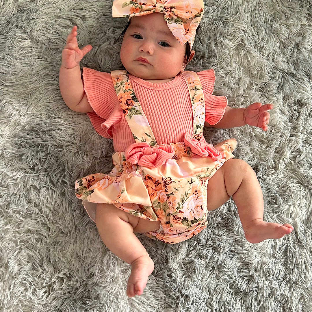 Chloe Joy joined the competition — help win amazing prizes! baby, bodypart, bonnet, cap, clothing, costume, cushion, dress, face, finger, hand, hat, head, homedecor, newborn, person, photography, portrait, sitting, swimwear
